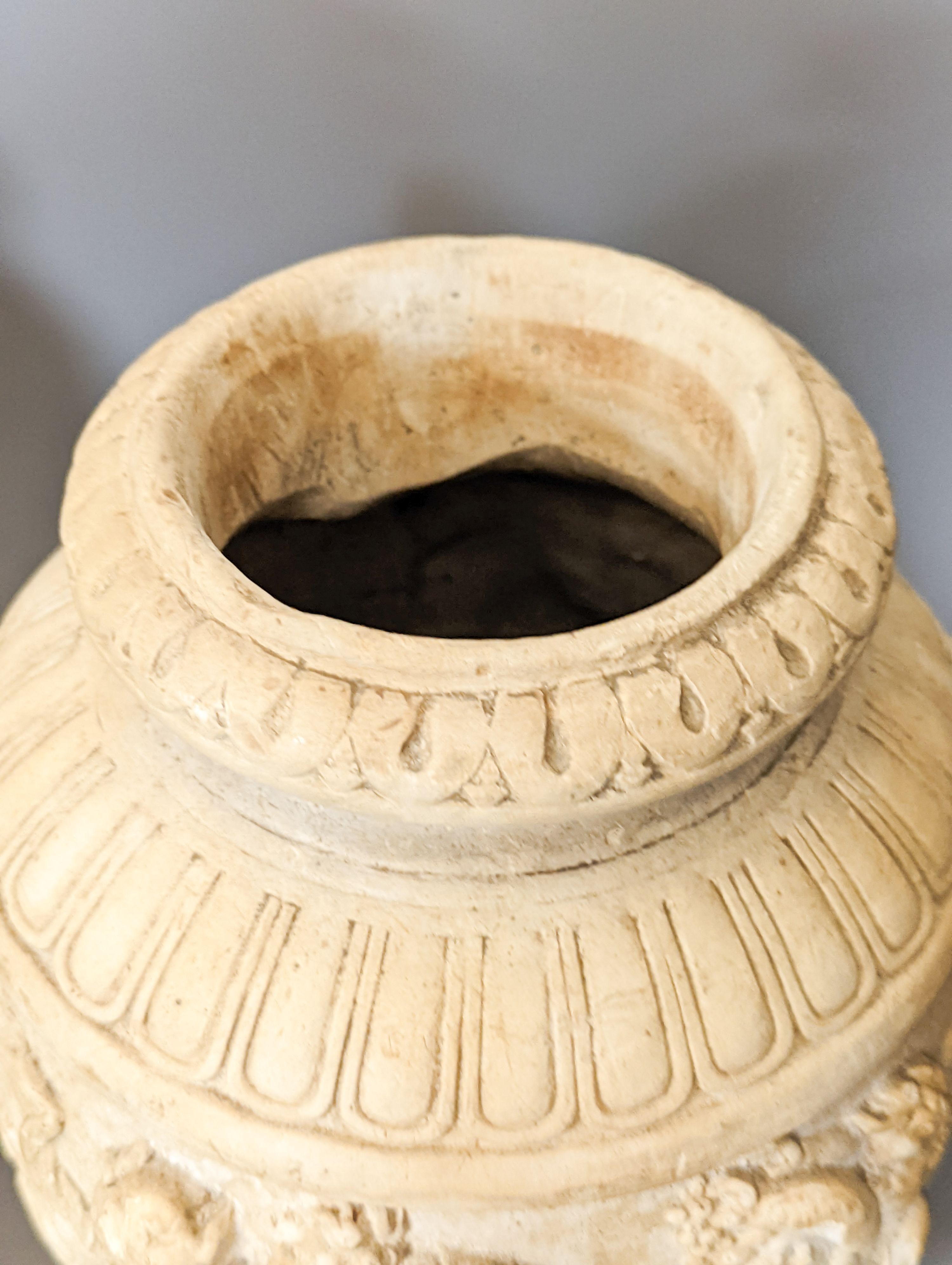 A pair of 19th century earthenware vases moulded in Italian renaissance style 30cm